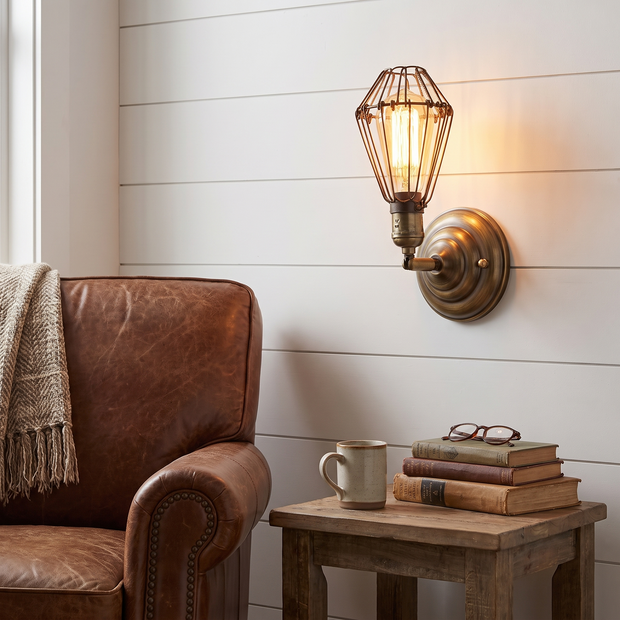 Industrial iron wall lamp beside farmhouse reading nook