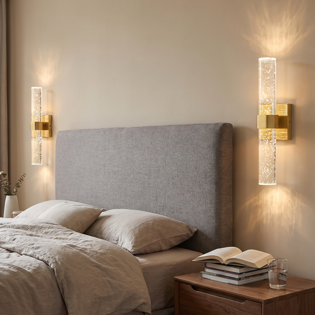 Pair of bubble crystal wall sconces flanking a headboard