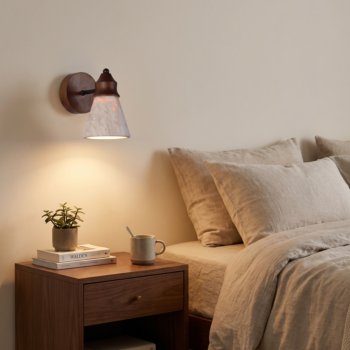 Travertine wood sconce above walnut nightstand