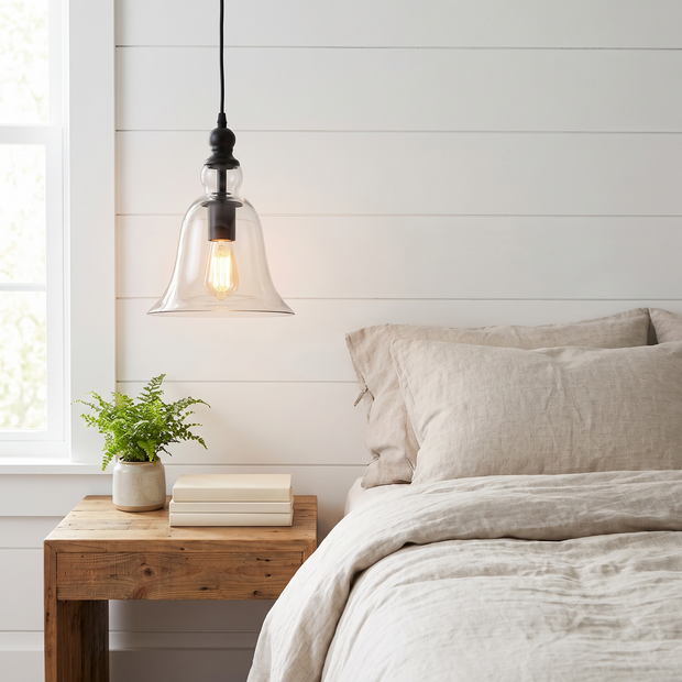 Vintage Iron and Glass Pendant Light beside a bed