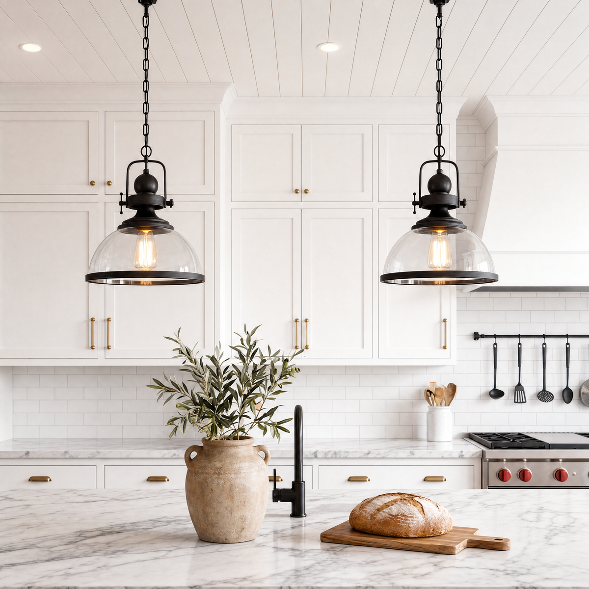 Clear Glass Bowl Pendant Lights over a marble kitchen counter