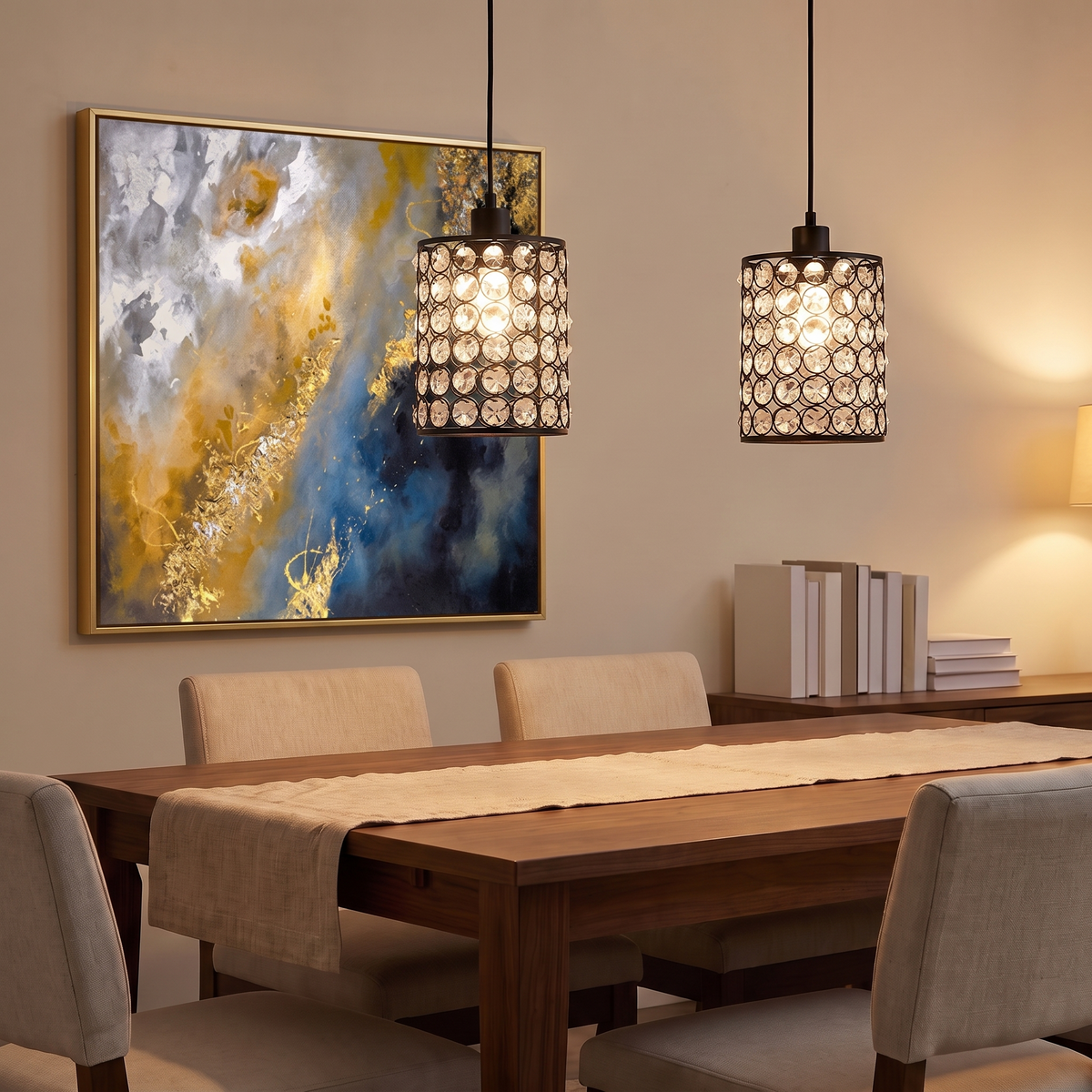 Pair of crystal cylinder pendant lights over a walnut dining table with framed abstract canvas art