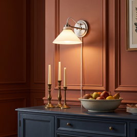 Aurenza milk glass globe sconce in a dining room