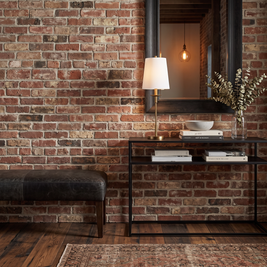 Rowan Linen Iron Table Lamp (tumbled brass) in a styled room
