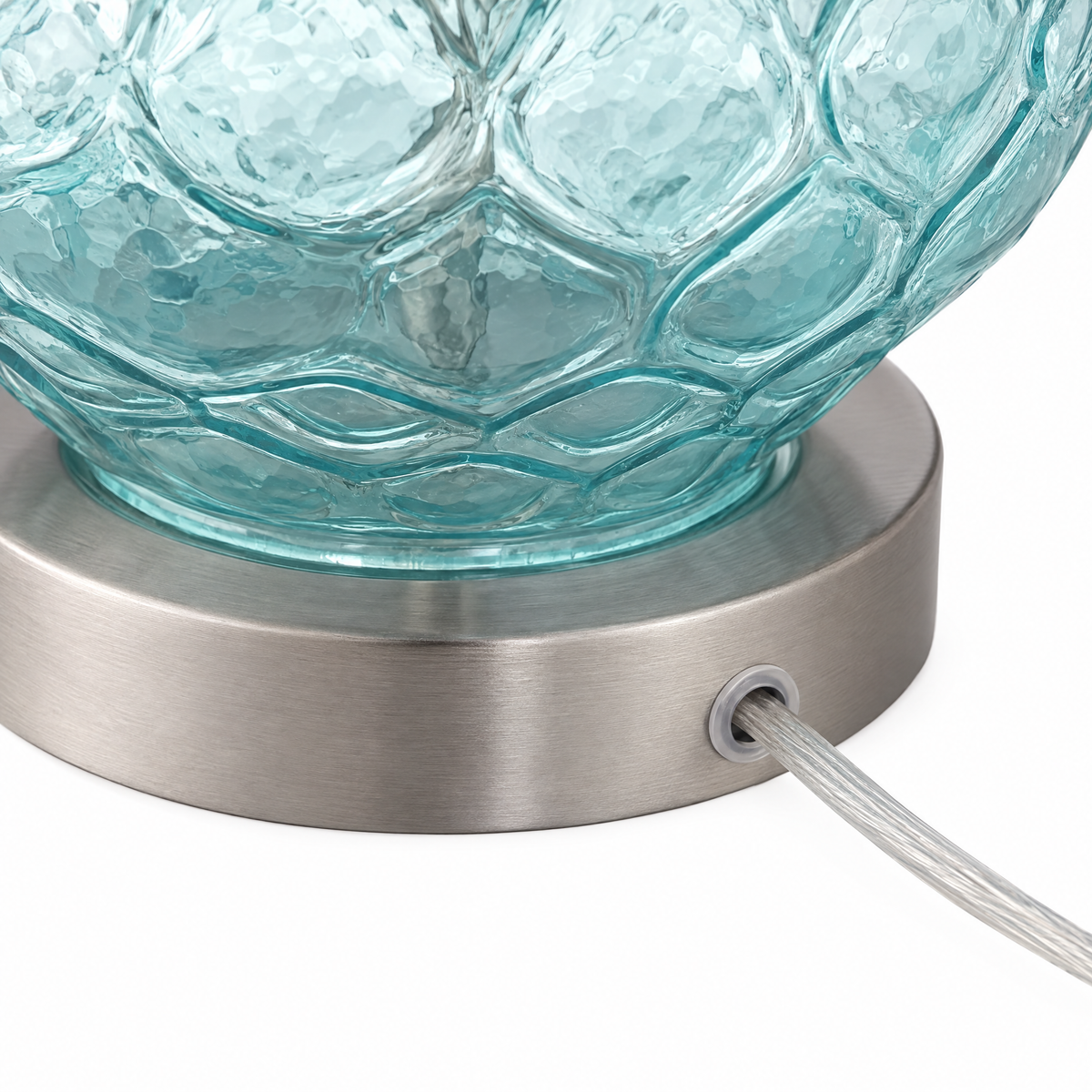 Brushed nickel lamp base and clear cord detail