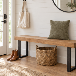 Dark sage jacquard pillow cover on an oak entryway bench against white shiplap